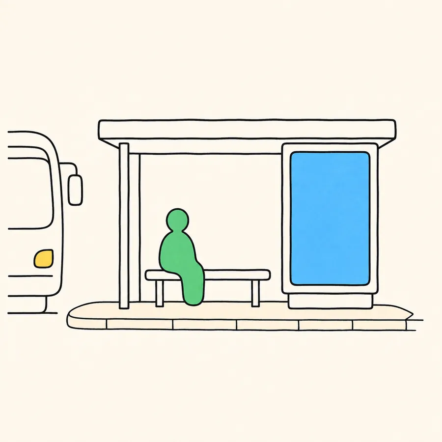 An illustration of a bus queue shelter with a lit advertising panel